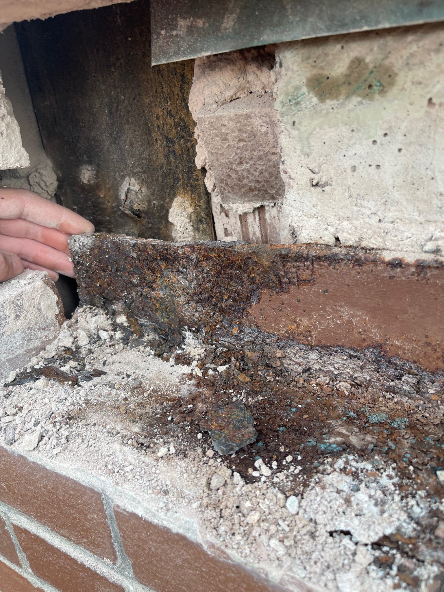 Corroded steel lintel exposed behind removed brickwork at the Charlottetown waterfront armoury