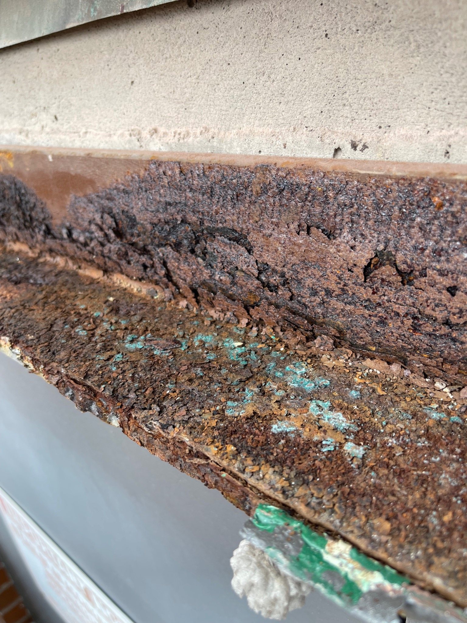 Severely corroded steel window lintel exposed during brick restoration at the Charlottetown armoury