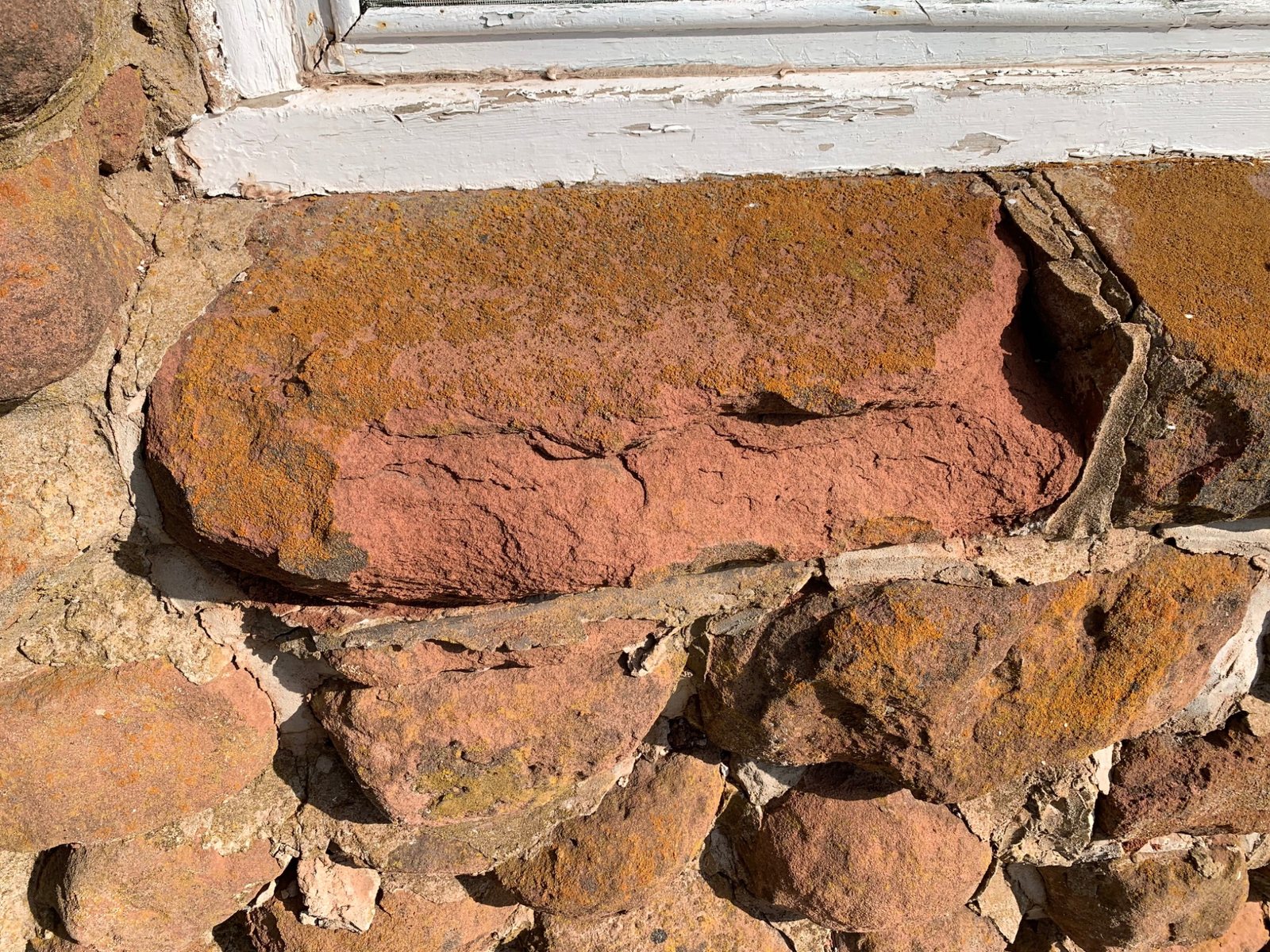 Weathered sandstone beneath a window at Dalvay by the Sea