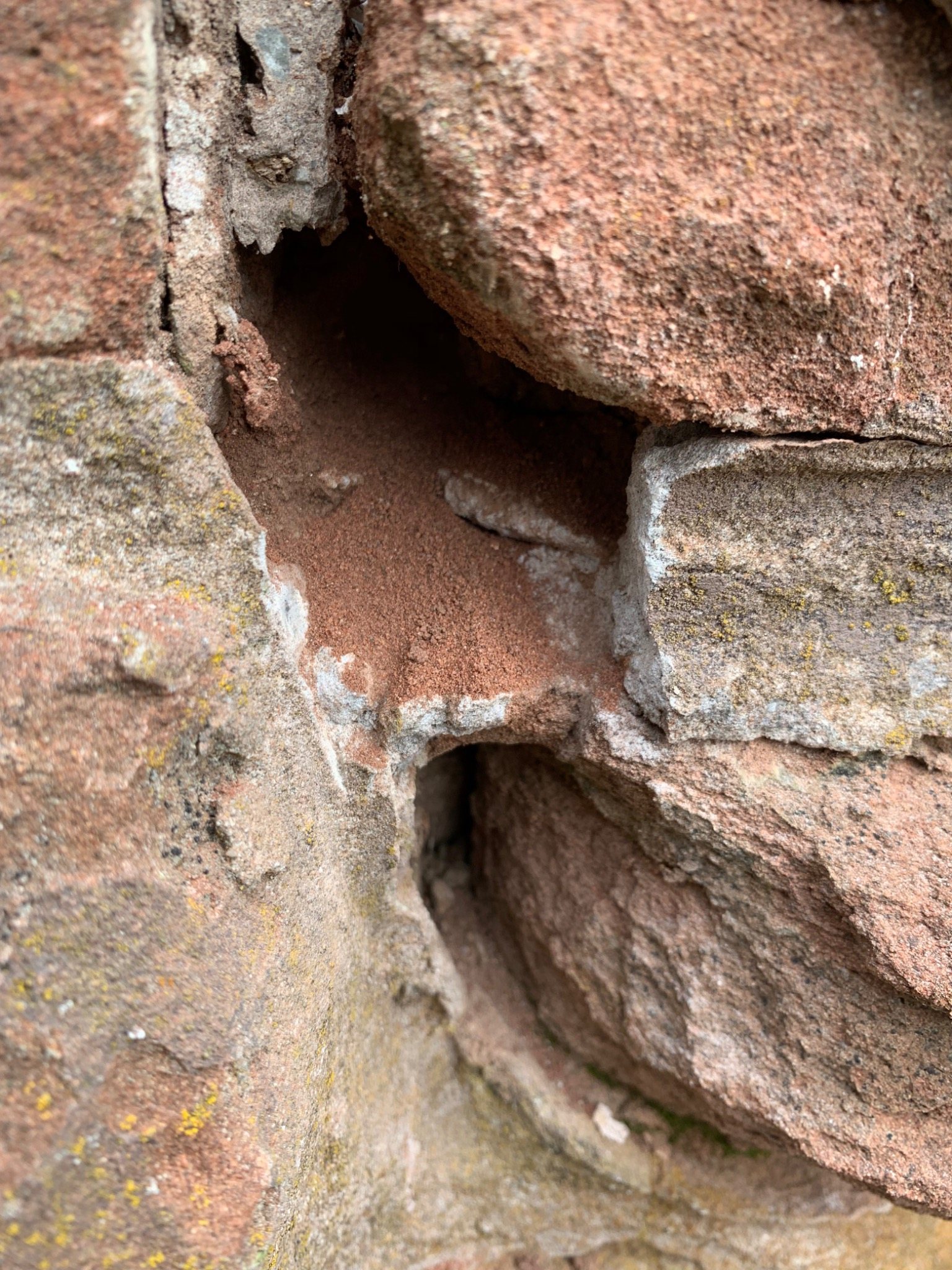 Close-up of eroded sandstone and open mortar joints at Dalvay by the Sea