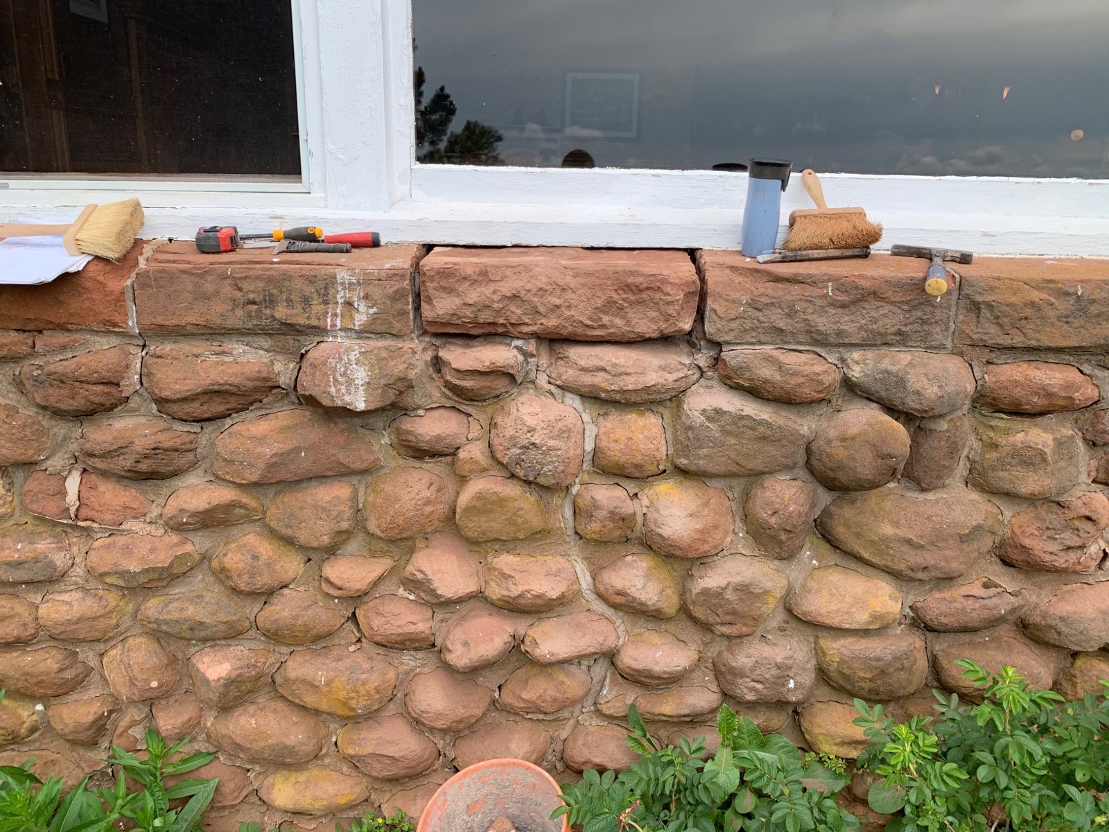 Stone window sill repair underway on historic sandstone masonry at Dalvay by the Sea
