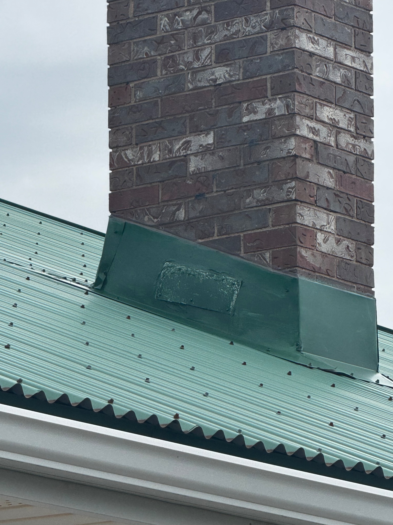 Masonry chimney on a steel roof after a lightning strike in Prince Edward Island