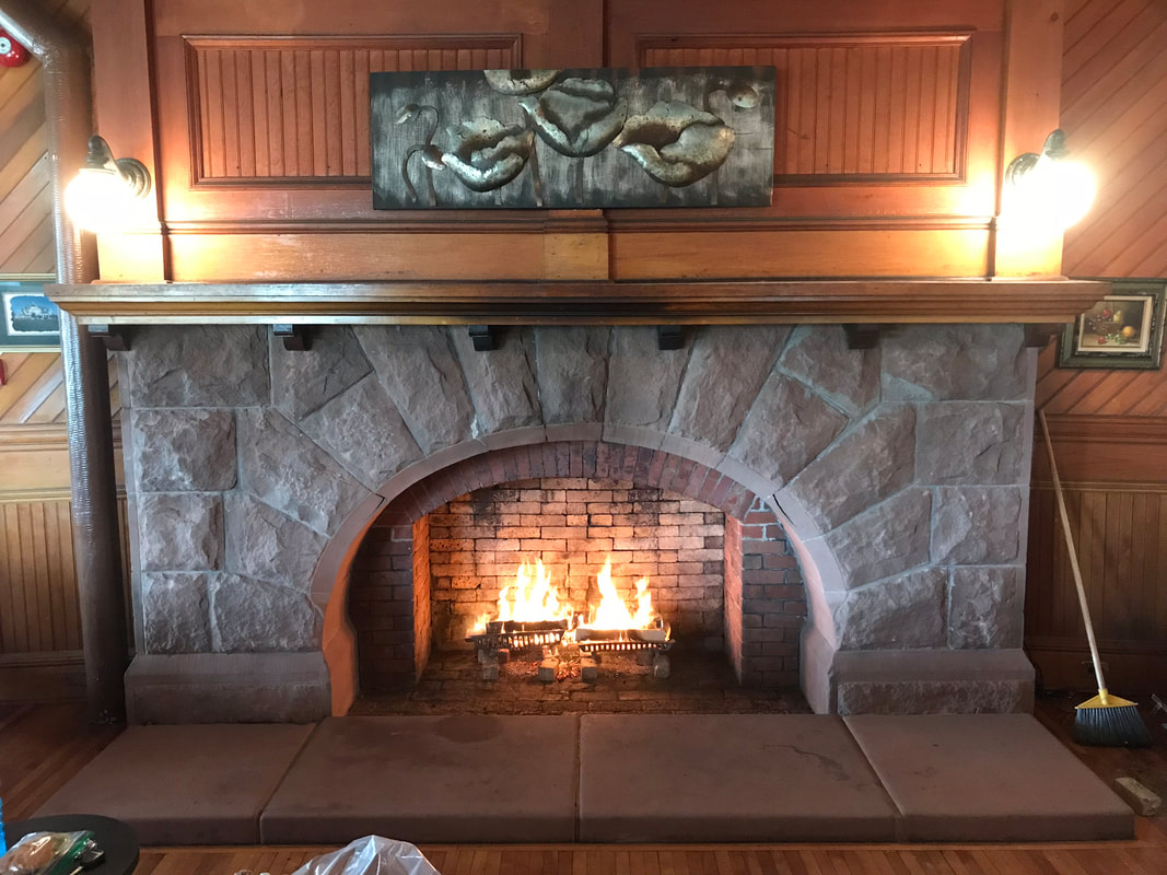 Brick fireplace hearth and firebox restoration in Prince Edward Island