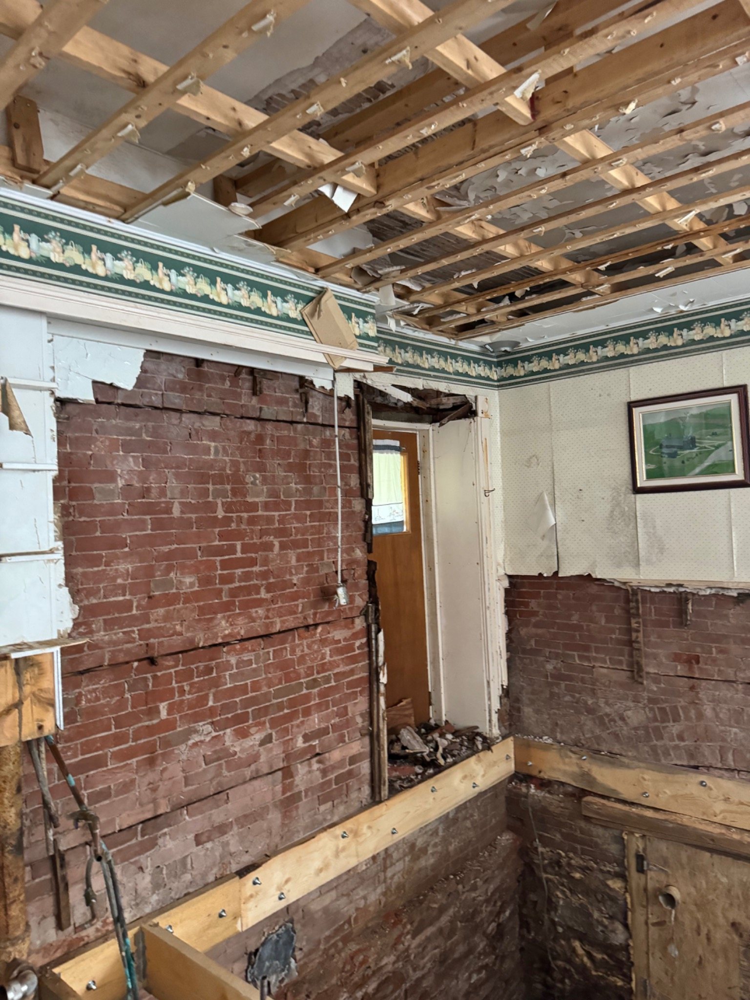 Exposed original brick walls during ongoing restoration inside the Mont-Carmel Parish House