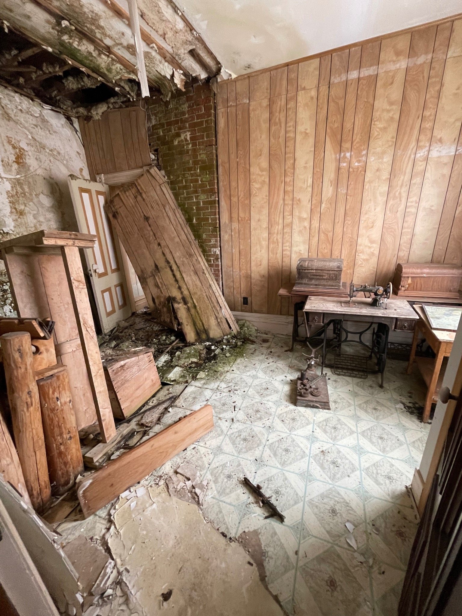 Collapsed and opened floor area inside the Mont-Carmel Parish House before reconstruction