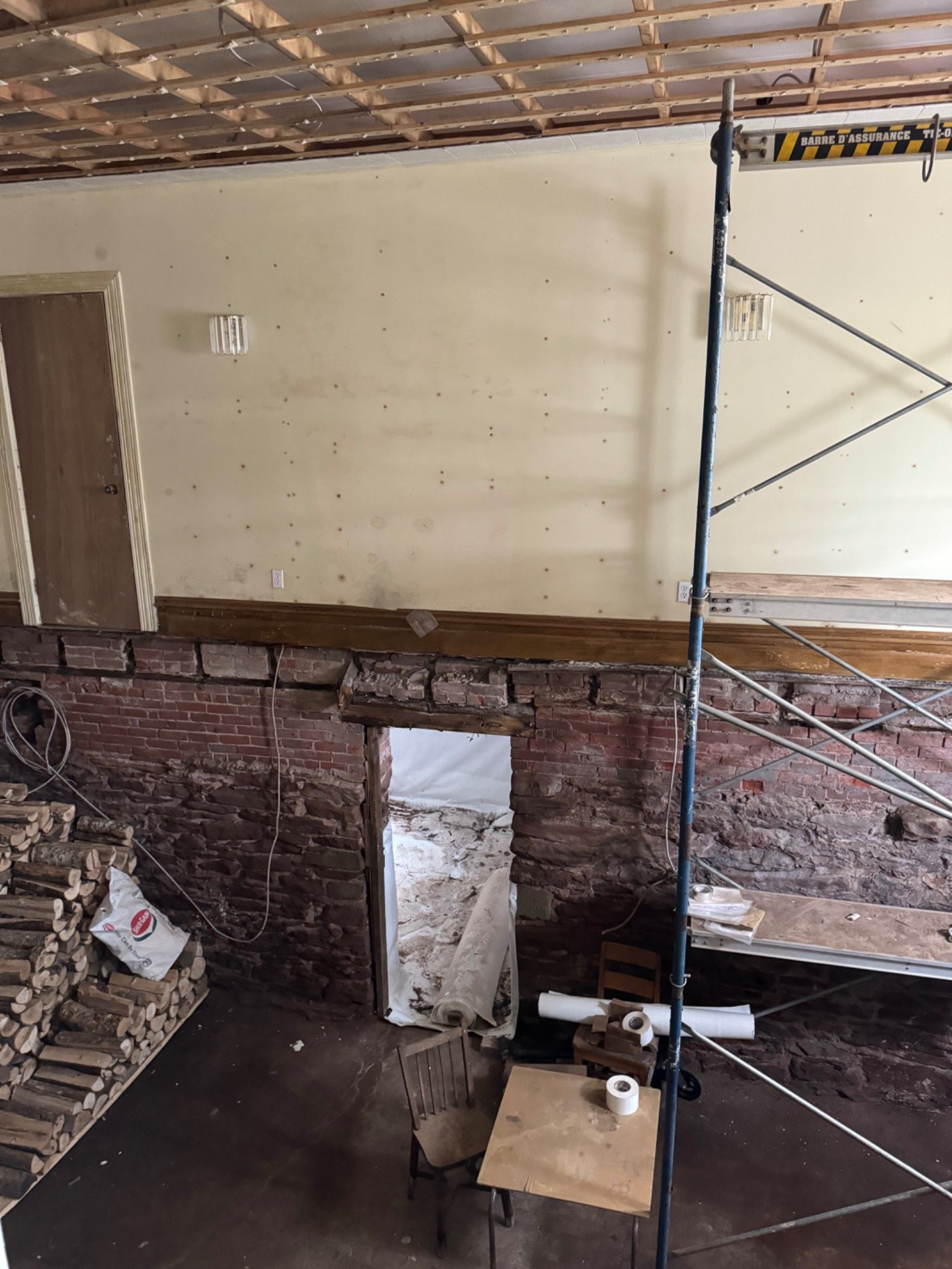 Ongoing structural restoration and exposed historic brick inside the Mont-Carmel Parish House