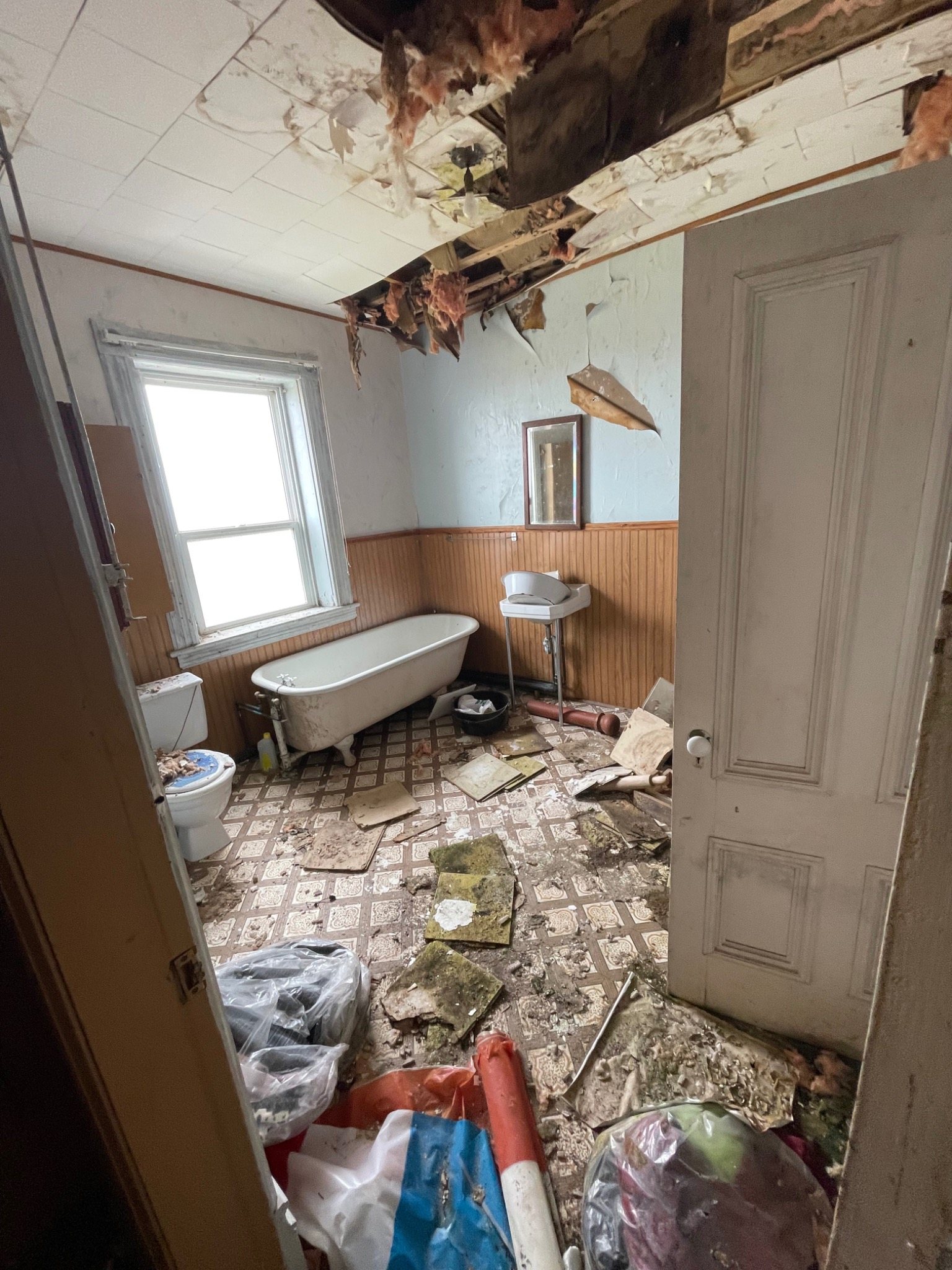 Water-damaged ceiling and interior finishes inside the historic Mont-Carmel Parish House
