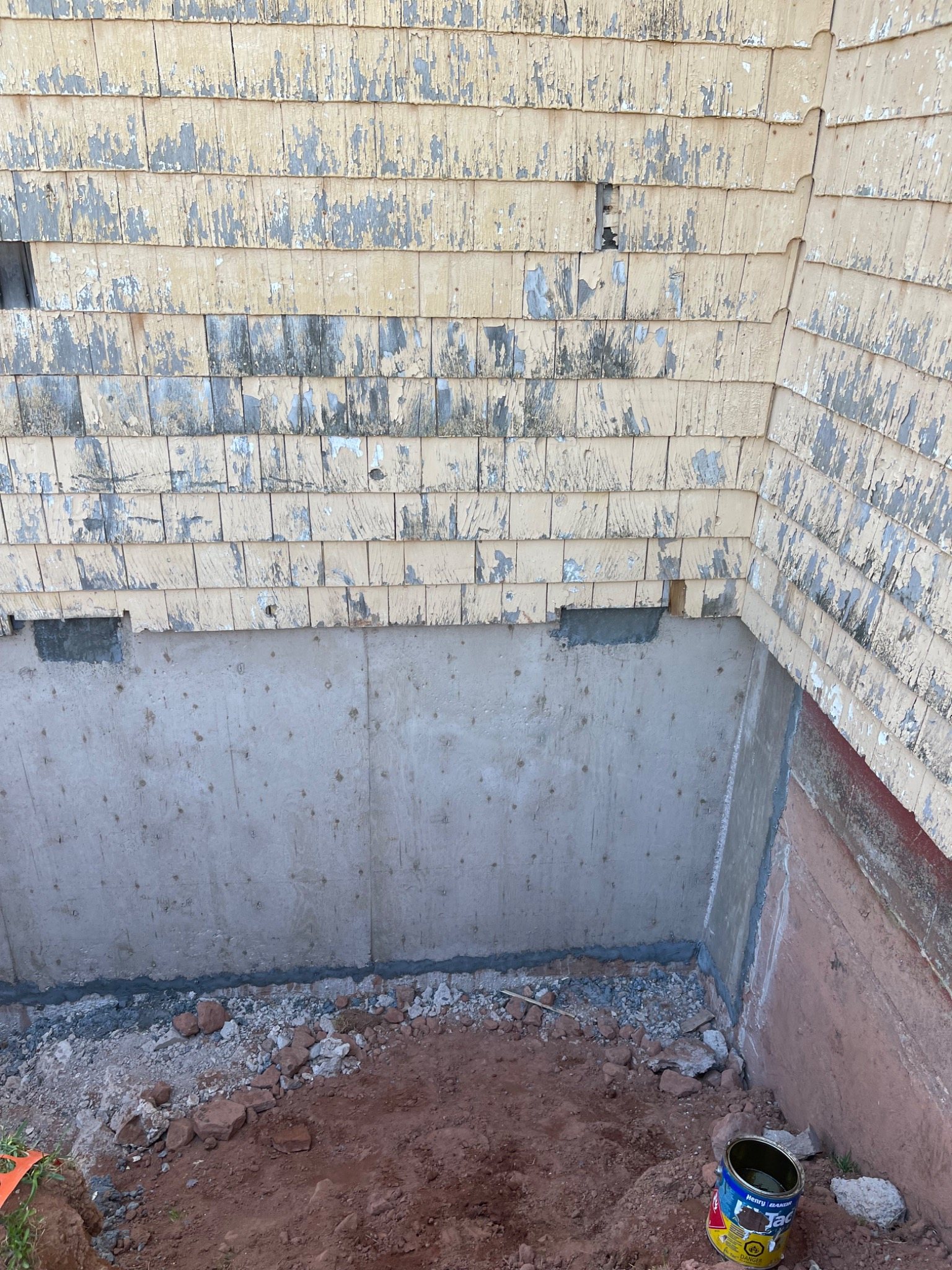 Reinforced concrete foundation wall repair on an older building