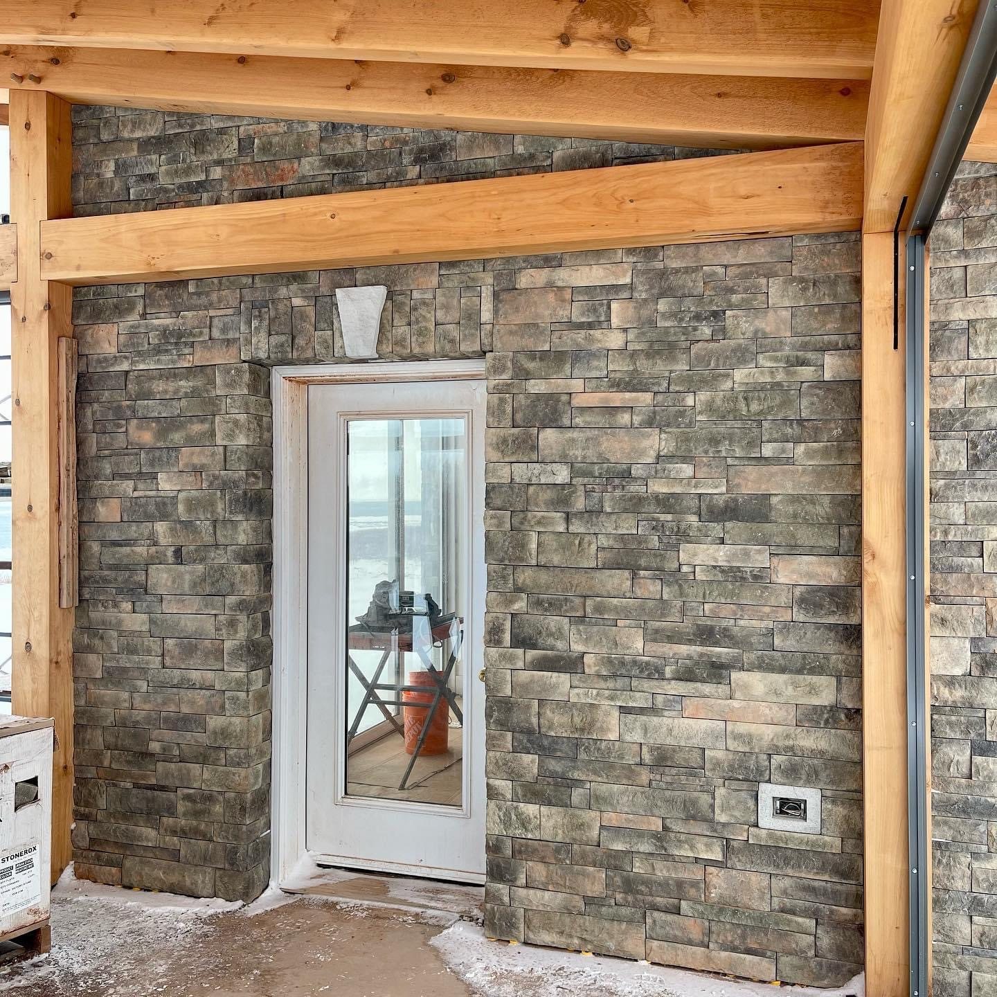 Finished exterior stone cladding on a residential entrance