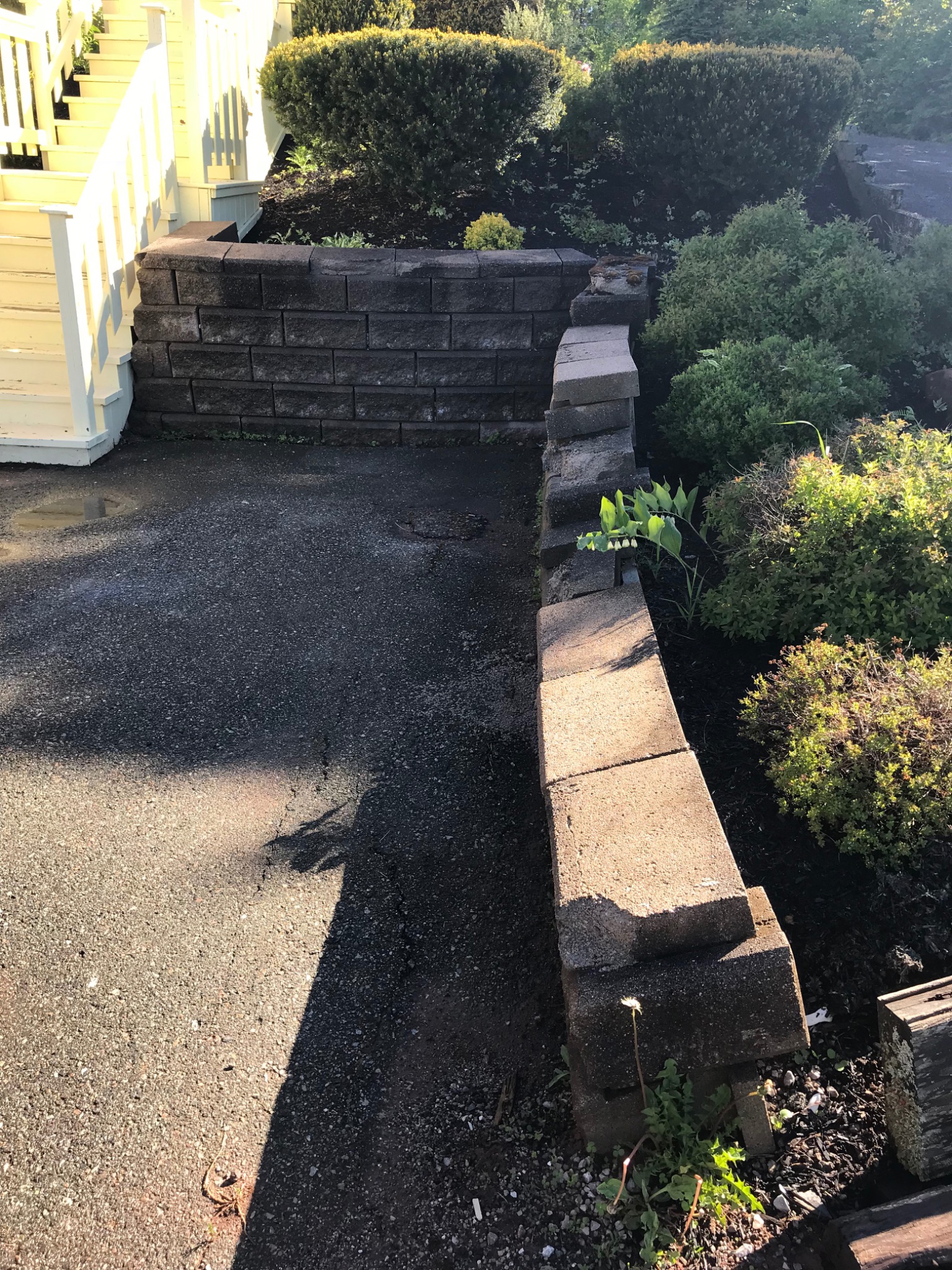Finished terraced retaining wall on a residential site showing stepped grade control