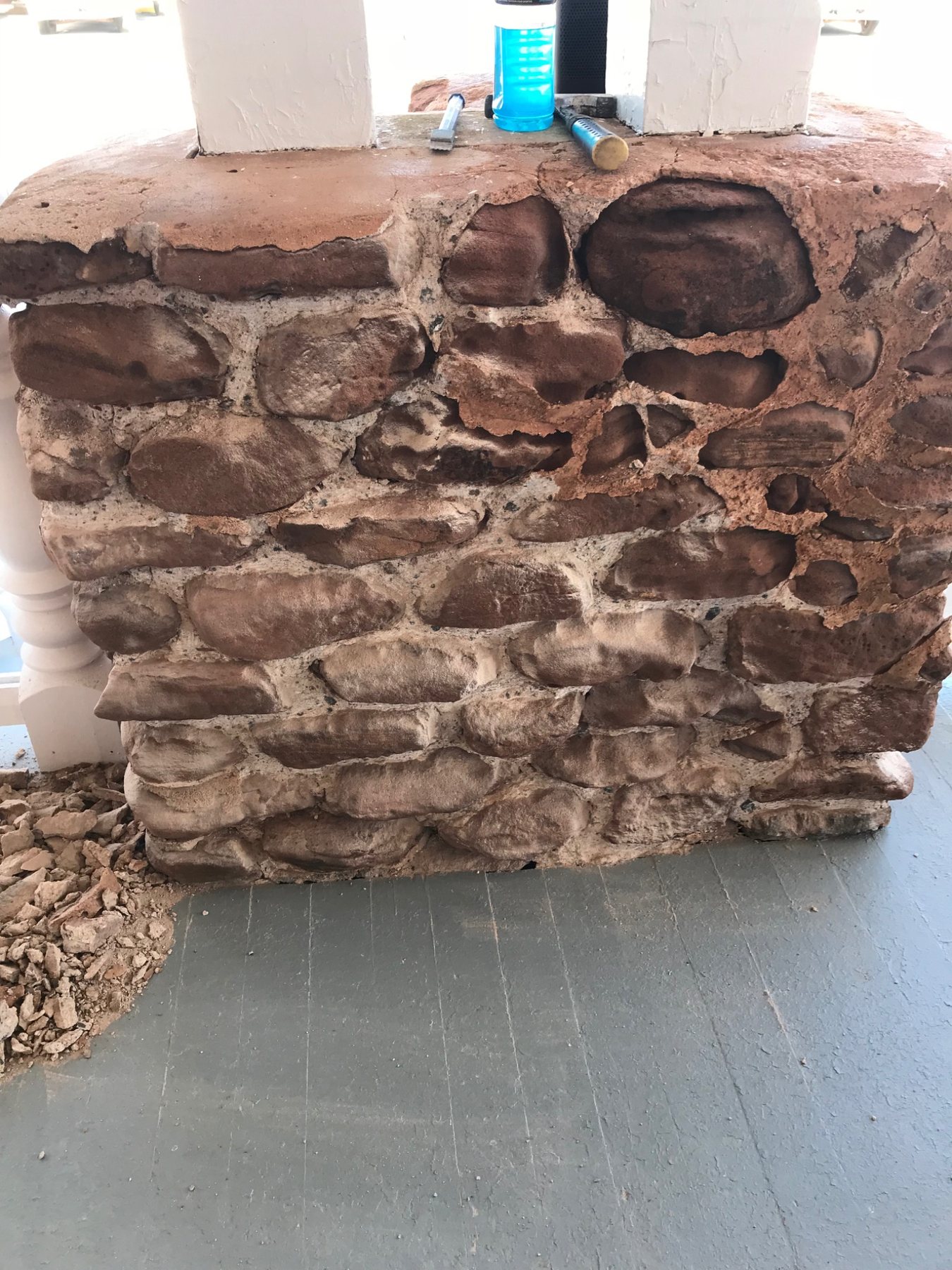 Exposed rubble stone masonry showing irregular stones, mortar and deeper voids